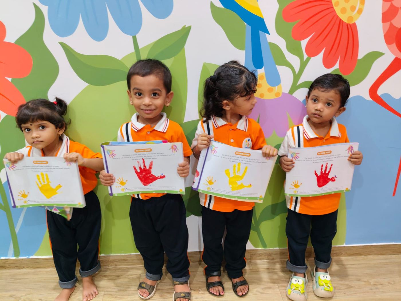 Handprint day — four artists, four certificates.
